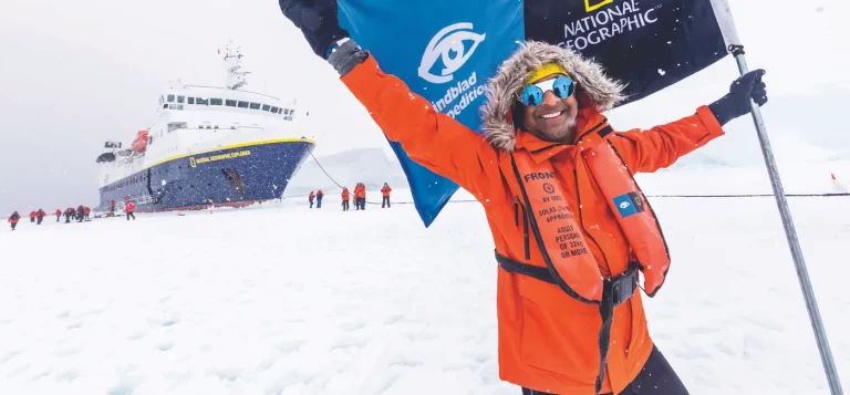 -A-man-holds-a-Lindblad-Expeditions-National